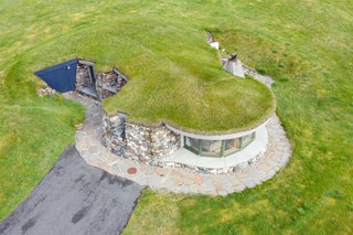 Aerial photo of a home with a turf roof