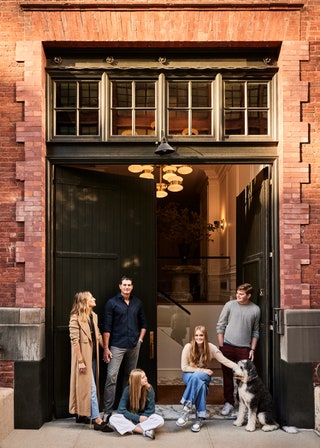 Baird and her family in front of their Tribeca home.